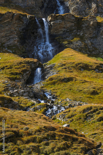 A small mountain stream flows down the mountainside.