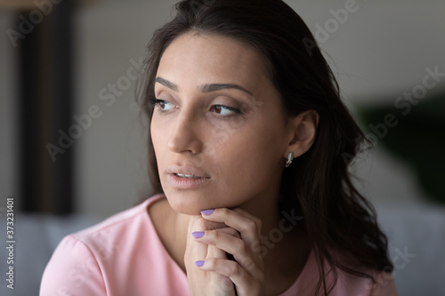 Obraz na plátně Pensive young beautiful indian Arabic woman look in distance thinking pondering