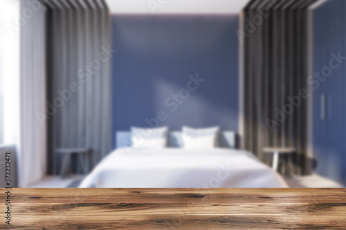 Table in blue and grey bedroom