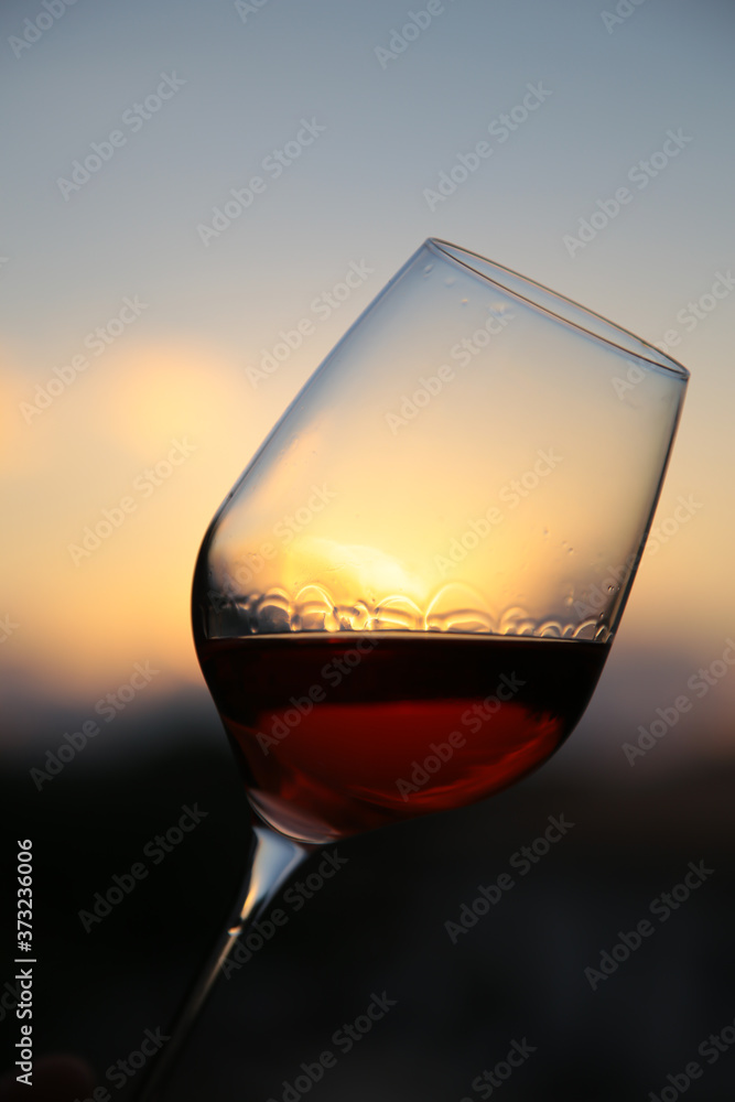 beautiful sunset with a glass of italian red wine