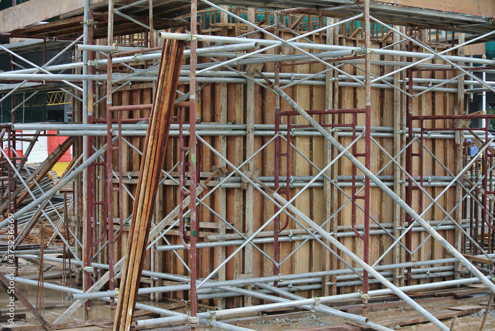 JOHOR, MALAYSIA -APRIL 13, 2016: Scaffolding used as the temporary structure to support platform, form work and structure at the construction site. Also used it as a walking platform for workers. 
