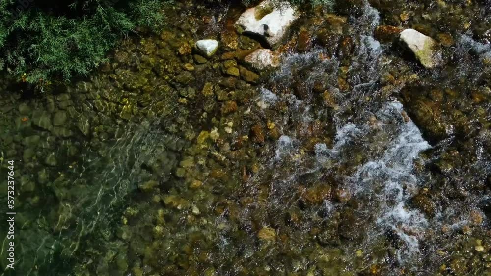 Top view of crystal river water flowing on wild mountain scenery,cilento,italy Top view of crystal river water flowing on wild mountain scenery,cilento,italy