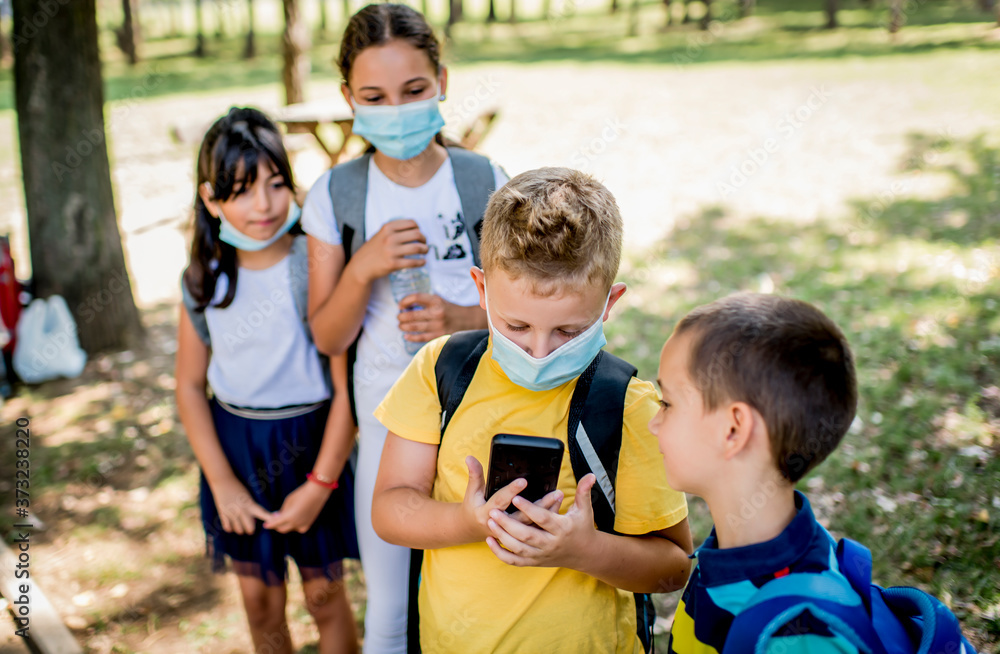 Children are going to school with protective face masks Children are going to school with protective face masks