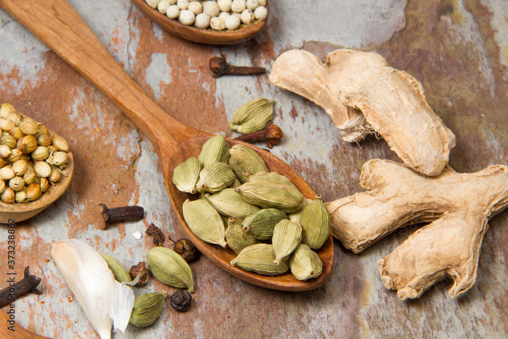 Aromatic spices on wooden spoons. Food ingradients.
Aromatic spices on wooden spoons. Food ingradients.
