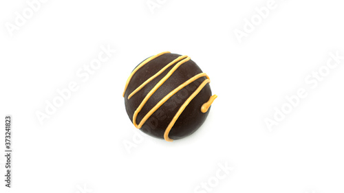 Delicious, round, chocolate candy with nuts on a white background. High quality photo