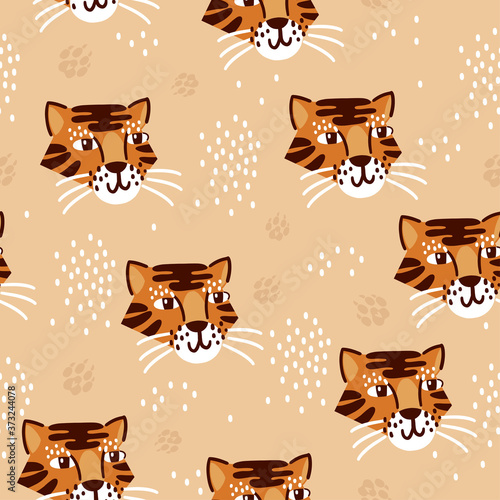 Seamless pattern with cute hand drawn tiger faces. Childish background for fabric, wrapping, textile, wallpaper, apparel.. Vector Illustration