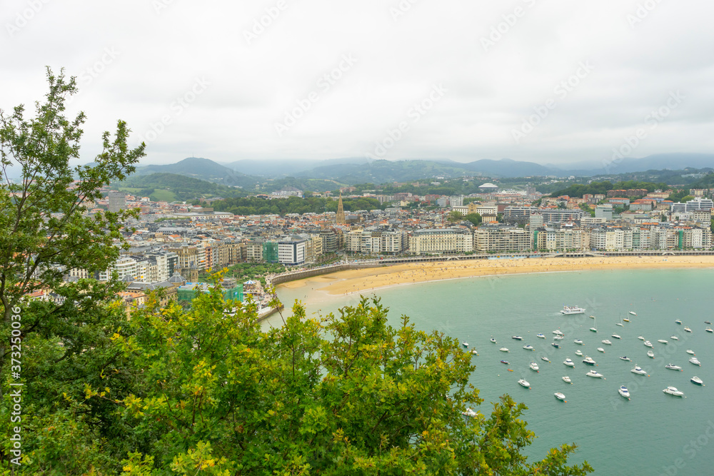 view of the city of San Sebastian, with La Concha beach, from Mount Urgull. Summer vacation scene in Spain