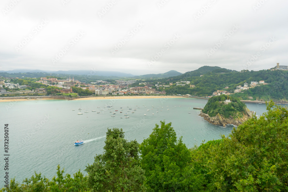view of the city of San Sebastian, with La Concha beach, from Mount Urgull. Summer vacation scene in Spain
