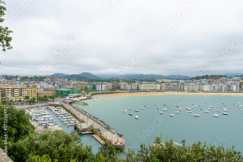 view of the city of San Sebastian, with La Concha beach, from Mount Urgull. Summer vacation scene in Spain