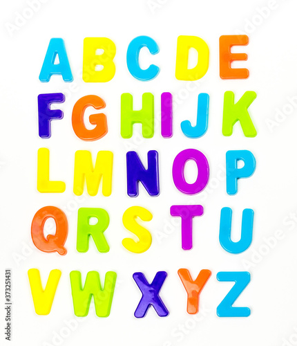 Plastic magnetic letters isolated on white  top view. Alphabetical order