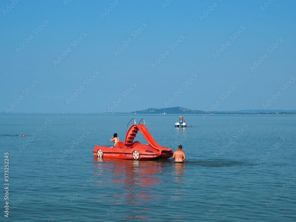 Red pedal boat in the lake Balaton, Hungary in summer
