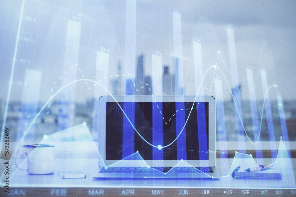 Forex Chart hologram on table with computer background. Double exposure. Concept of financial markets. Forex Chart hologram on table with computer background. Double exposure. Concept of financial markets.