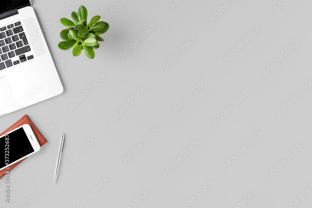 Modern office desktop with laptop. Business background with copyspace Modern office desktop with laptop. Business background with copyspace