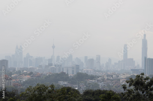 Photography Hazy Kuala Lumpur city skyscape due to  haze from forest fire