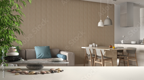 Wallpaper Mural White table shelf with pebble balance and 3d letters making the word feng shui over modern white kitchen and living room, marble tiled floor, zen concept interior design Torontodigital.ca