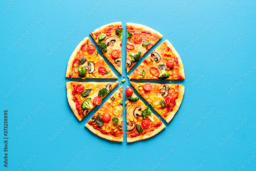 Pizza primavera slices top view. Vegetarian pizza flat lay. Sliced pizza.