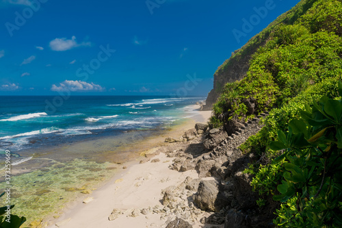 Tropical wild beach in Bali. Sandy beach and ocean