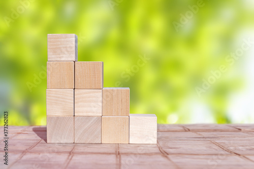 Wood cube arrange in pyramid shape ,business concept.