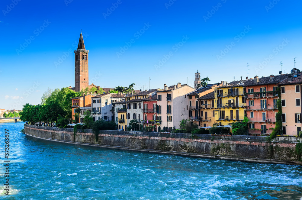 View of Verona and the Bell tower of the church of Santa Anastasia from the Ponte Pietra bridge. Verona. Italy