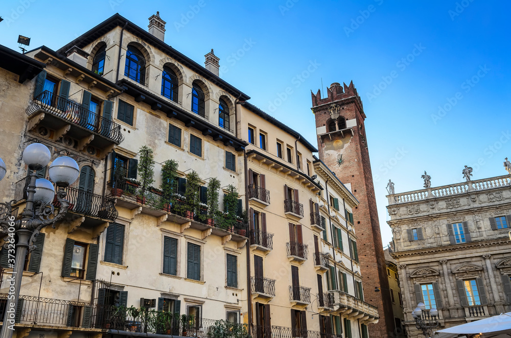 Medieval architecture of Verona, houses on the Piazza Erbe  with preserved frescoes . verona, Italy