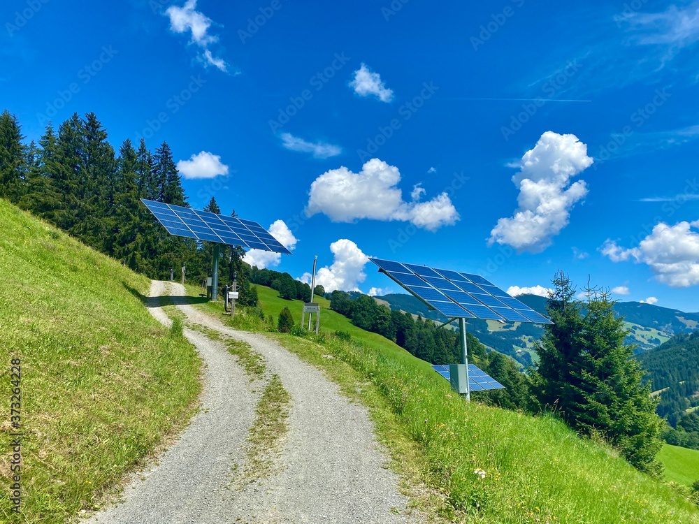 Stockfoto Solar power panels in front of a ecofriendly mountain resort