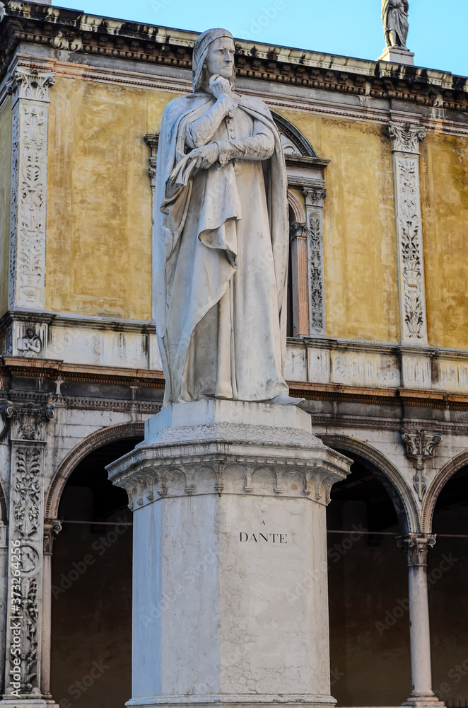 The monument to Dante was erected on Signoria Square in 1865 . The monument was made of  Carrara marble by the sculptor Hugo Zannoni. Verona, Italy.