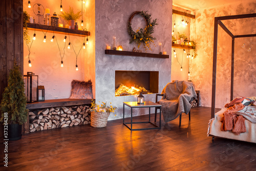 luxury studio apartment with a free layout in a loft style in dark colors. Bedroom area with fireplace.