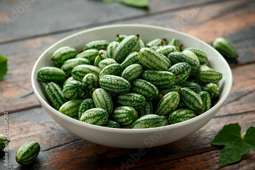 Freshly picked Cucamelon in white bowl. vegetable healthy food photo