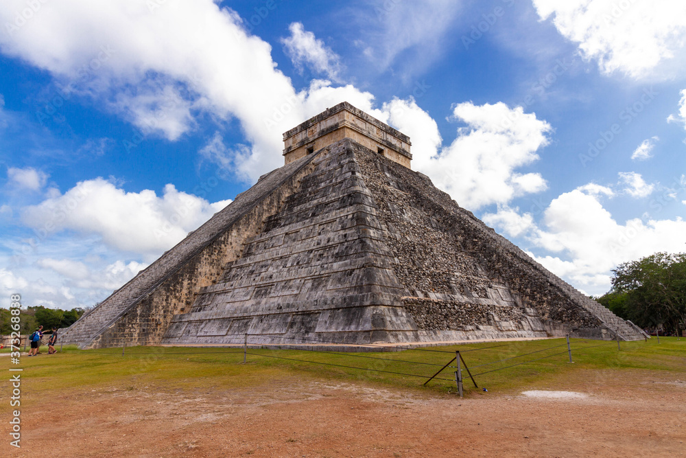 Yucatan/Mexico - December 29 2018 : Tourists visit Kukulkan pyramid at Chichen-Itza archaeological site, Yucatan, Mexico.