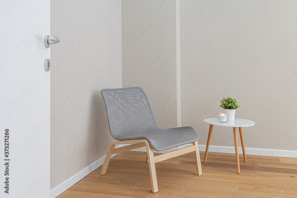 Fototapeta premium Modern wooden grey chair with a wooden white table in minimal style