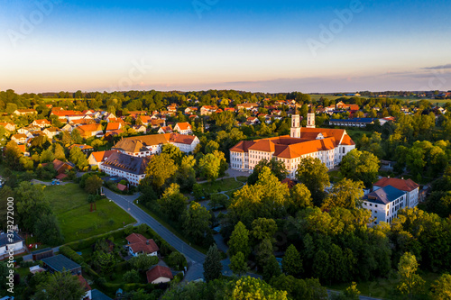 Aerial view in the early morning, Irsee, Benedictine monastery in Irsee, Diocese of Augsburg, Bavaria, Germany,