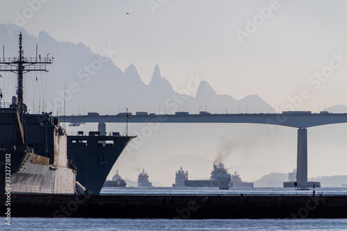 boats in guanabara bay with the rio niteroi bridge and the teresopolis mountain range in the background in rio de janeiro photo