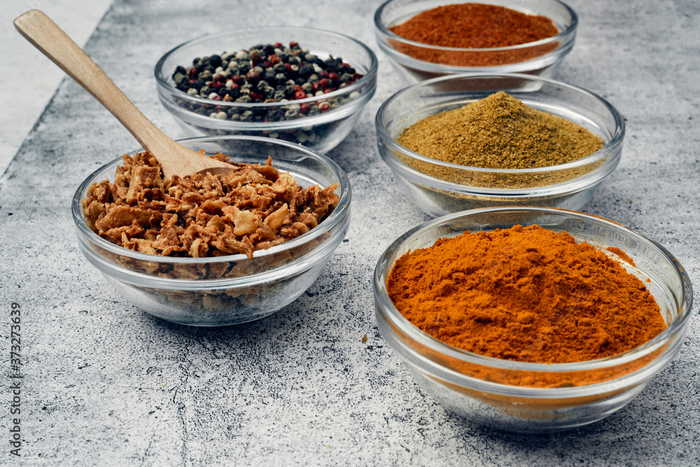 Spices and spices in glass saucers. Cooking and kitchen. Spices and spices in glass saucers. Cooking and kitchen.