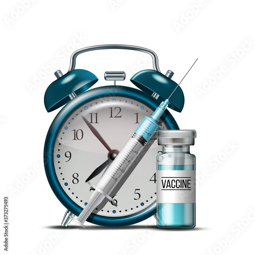 Time to vaccinate concept. Syringe, bottles of vaccine and alarm clock.