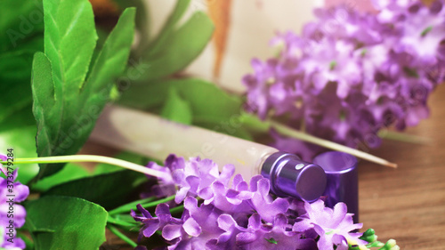 The clear luxury body perfume bottle spray and purple flower © sabdiz