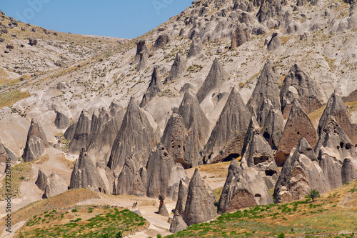 Volcanic rock formations known as fairy chimneys and extreme terrain of Cappadocia in Ihlara, Turkey. photo