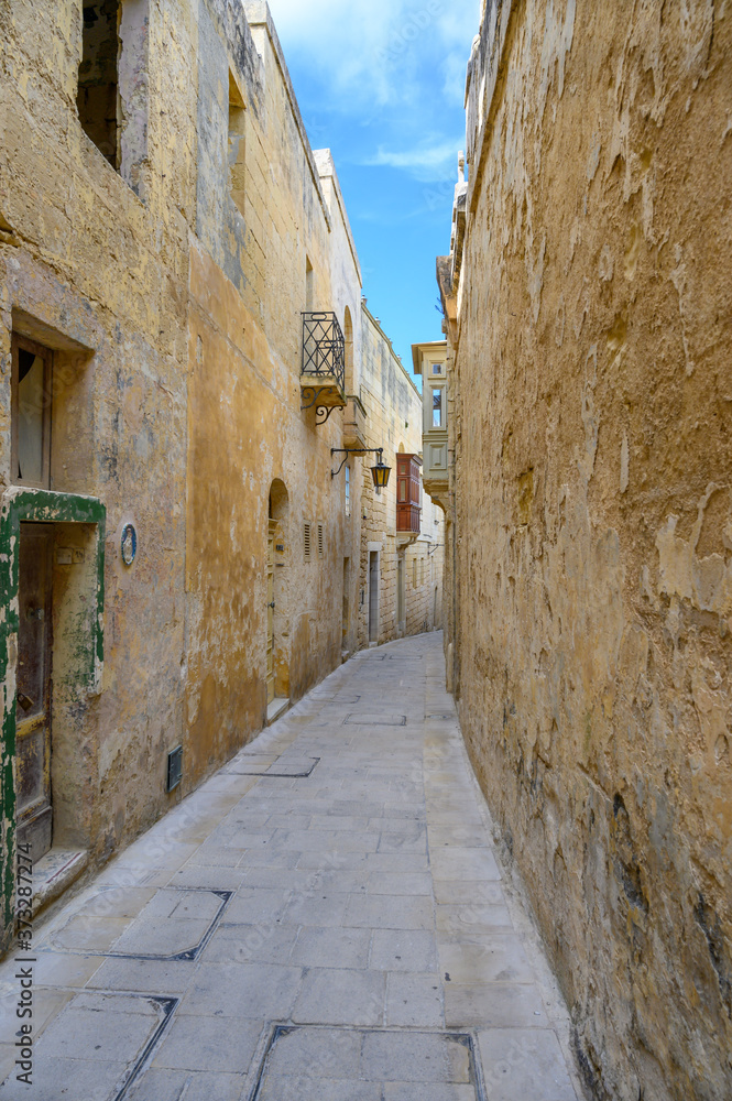 Narrow street in the ancient Maltese city of Mdina on the island of Malta.