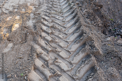 Tractor tire tracks on the sand © Сергей Храмов