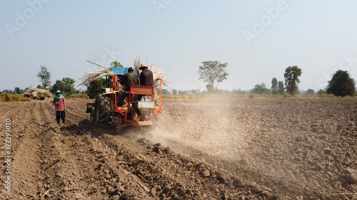Sugarcane cultivation using farm machinery.