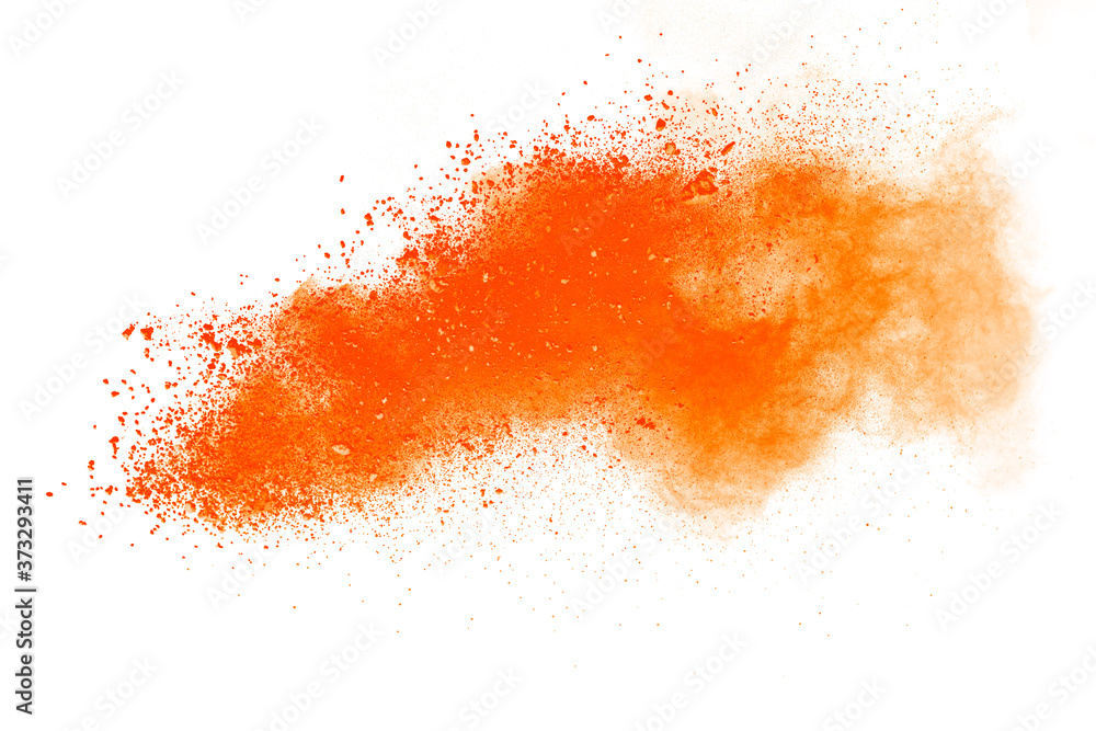 Abstract orange powder explosion isolated on white background.