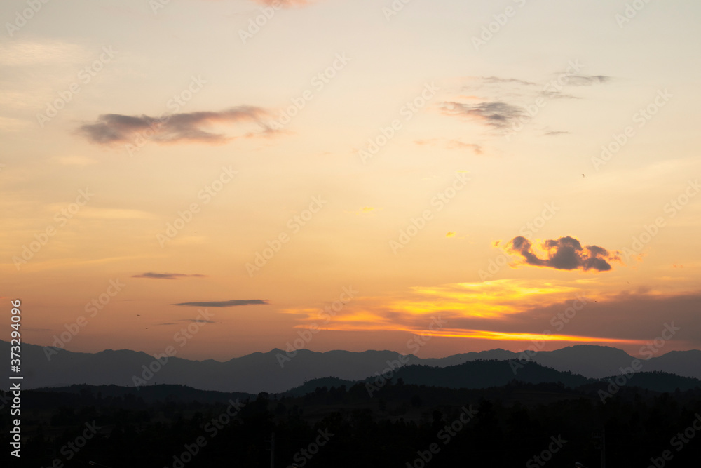 Land with and dramatic colorful sky at sunset Land with and dramatic colorful sky at sunset
