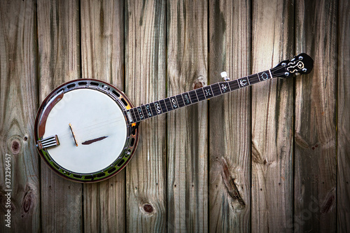 Konstfotografi 5 String Banjo on a brown rustic natural wood background
