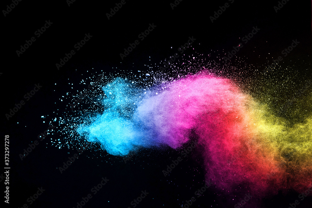 Fototapeta premium Explosion of colored powder isolated on black background. 