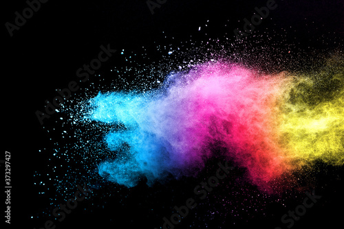 Explosion of colored powder isolated on black background. 