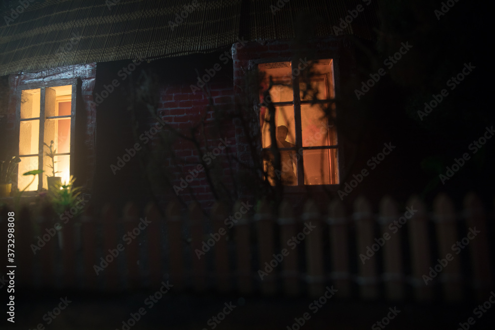 Fototapeta premium Sad, depressed man during the coronavirus quarantine staying at home, going mental and crazy. Covid-19 home isolation