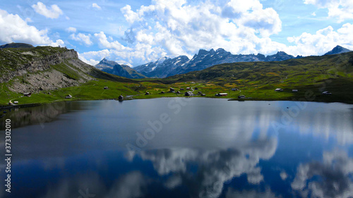 Wonderful Mountain Lake in the Swiss Alps - aerial view - travel photography © 4kclips