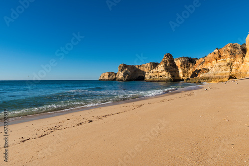 View of the scenic Marinha Beach (Praia da Marinha) in the Algarve region, Portugal; Concept for travel in Portugal and summer vacations.