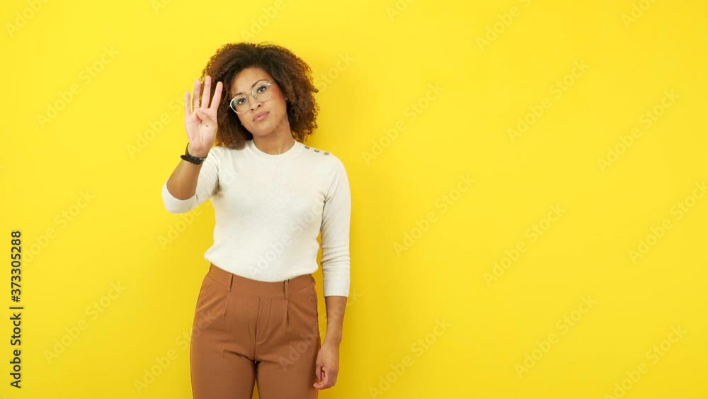 Young african american woman showing number seven Young african american woman showing number seven
