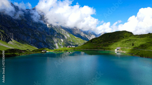 Flight over a wonderful mountain lake in the Swiss Alps - Lake Truebsee on Mount Titlis - travel photography