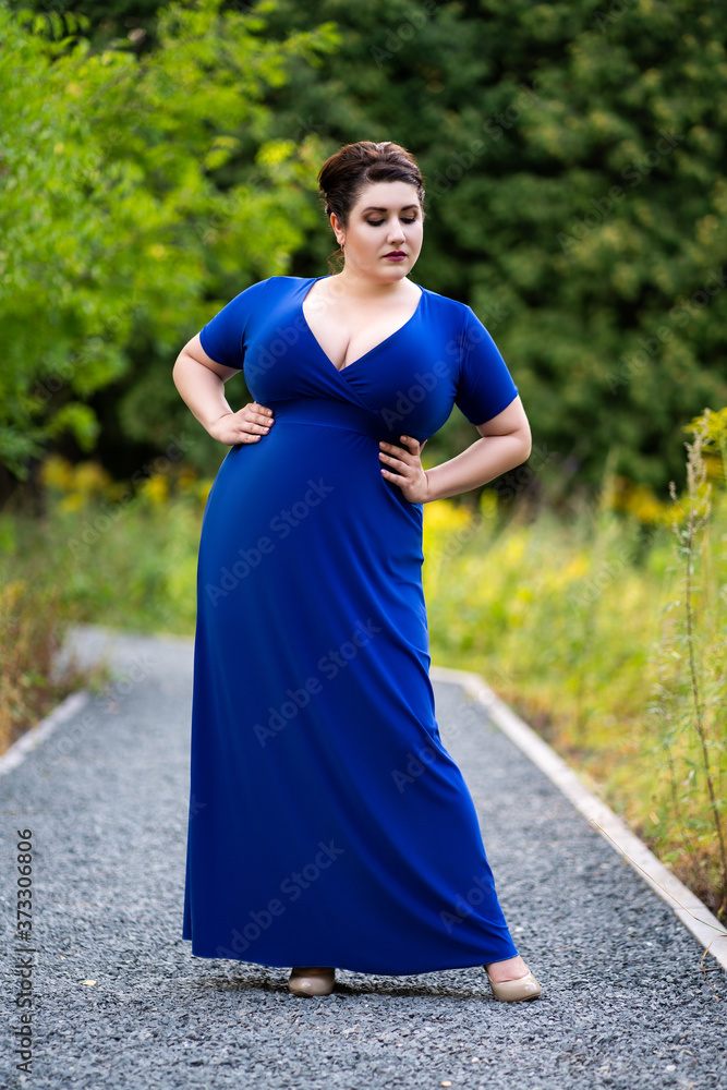 Plus Size Model in Blue Dress with a Deep Neckline Outdoors, Beautiful Fat  Woman with Big Breasts in Nature Stock Image - Image of beauty, loss:  212657321